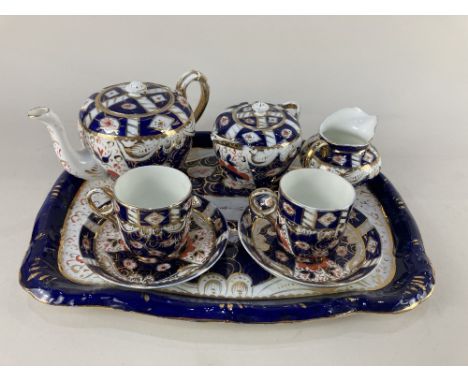 A Sandland Imari pattern porcelain cabaret tea set, comprising teapot, sugar bowl and cover, milk jug, two cups and saucers (