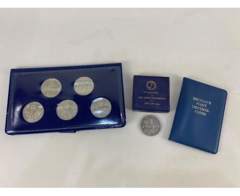 The Queens silver jubilee 1977, a set of five collectors coins, together with two 1953 crowns and a Britain's first decimal c