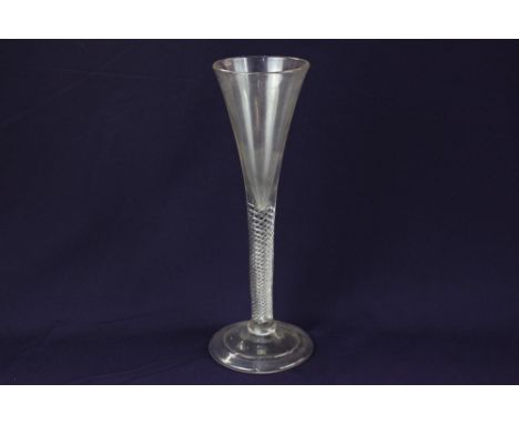 An 18th century wine glass, with trumpet bowl and air twist stem, on folded conical foot, 22.5cm high, to the present owner b