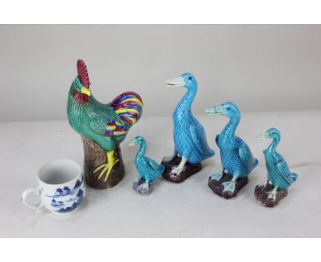 Four Chinese ceramic models of ducks, of graduated size, in turquoise and purple glaze, tallest 16.5cm high, together with a 