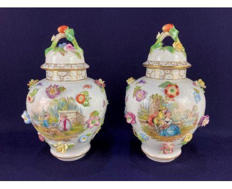 A pair of Dresden porcelain vases and covers, of baluster form, with applied flowers, and scenes of lovers amongst flowers an