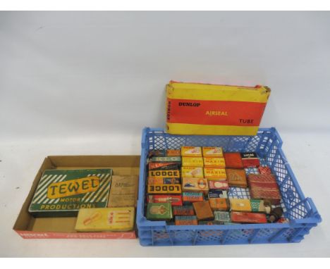 A tray of assorted spark plug and bulb packing, some with contents, plus a Dunlop Airseal tube box etc. 