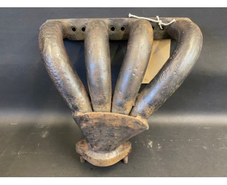 An original Bugatti exhaust manifold, with repairs.