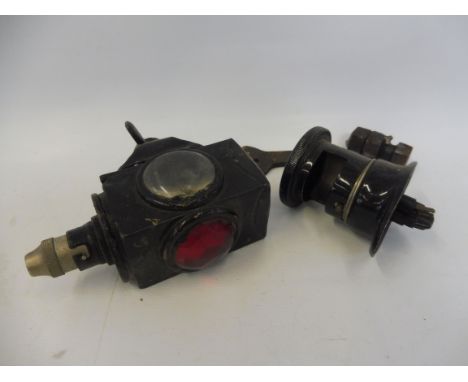 An early motorcycle rear mounted tail light plus a Lucas type D20 dash light.