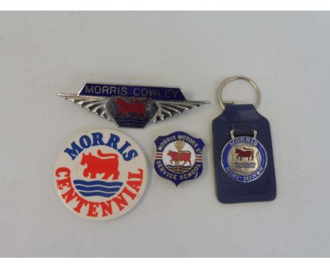 A Morris Motors Ltd Service School enamel lapel badge, a Morris Cowley radiator badge, a Morris Mini Minor keyring and a badg