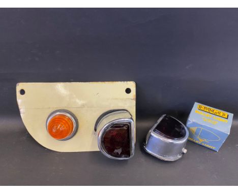 Two 'D'-shaped rear lights, one mounted with an indicator plus a boxed bullet light.