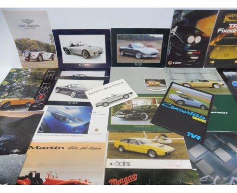 A quantity of British sports car brochures including AC, Aston Martin, Lotus, Marcos, Martin, MG, Panther, Morgan, Triumph, T