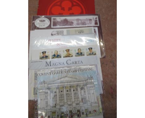 An envelope containing a number of select royal mail items including presentation packs , some first day covers and some spec