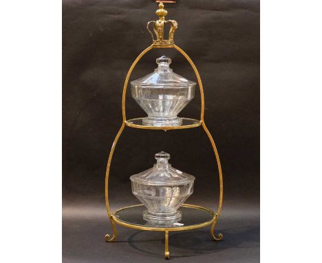 A gilt metal and glass two-tier cake stand with crown finial, 76cm high, together with two 20th century moulded glass dessert