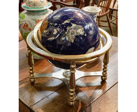 A modern table globe, the countries made up from different hardstones and with a compass inset to the base Condition report: 