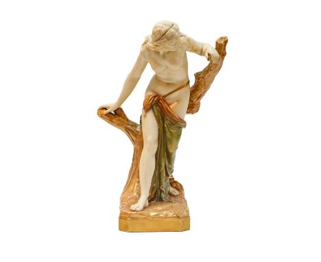 A Royal Worcester blush ivory figure of a bather against a tree stump, puce mark to base, 38cm high Condition report: In very