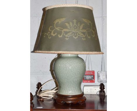 A Celadon glazed vase on carved wooden stand, converted to a table lamp, 28cm high (without lamp fitting)