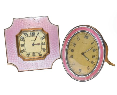 ~ An early 20th century oval strut timepiece with pink guilloche frame, dial inscribed E. Gubelin, Lucerne, together with a s