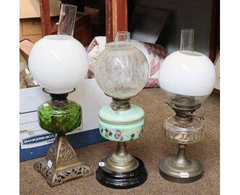 Three early 20th century oil lamp with glass shades and a French 1869 pattern bayonet, lace bobbins, copper kettle, brass tri