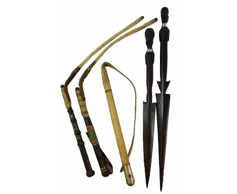 Two North African Camel Whips, each with short woven sinew thong and leather covered handle with wire bands and inset steel e