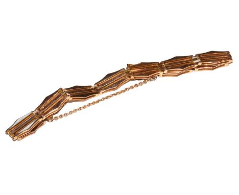 A gate link bracelet, stamped '9CT', length 18.3cmCondition report: The bracelet is in good condition with slight wear commen