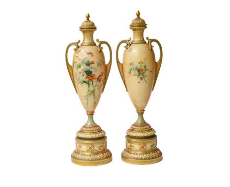 Royal Worcester, a pair of twin-handled vases with integral covers, blush ivory decorated with floral sprigs, raised on stepp