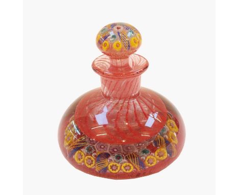 A millefiori glass ink bottle and stopper, the knop and base set with concentric canes, 11cm high, together with circle of Ed
