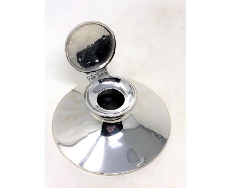 A silver inkwell, Birmingham marks, diameter 12.5cm.  CONDITION REPORT: Lacking glass liner. 