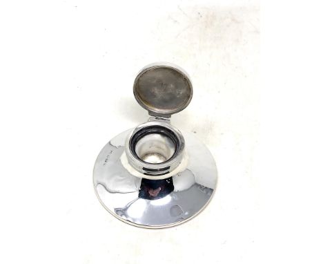 A silver inkwell, Birmingham marks, diameter 10cm.  CONDITION REPORT: Lacking glass liner. 