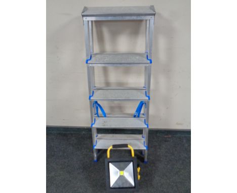 An aluminium folding twin sided step ladder together with a site light 