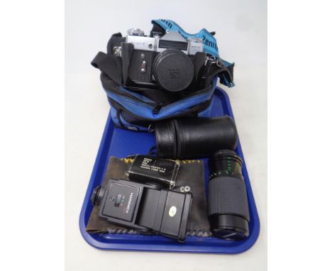 A tray of a Zenit-E camera with lens in bag, together with further Ensinor lens and camera flash 