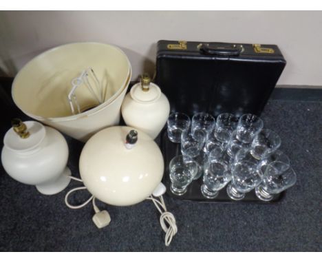 A tray of assorted drinking glasses together with a pair of ceramic table lamps with shades and a further crackle glazed tabl