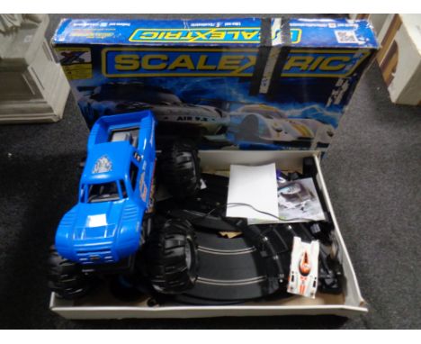 A Scalextric continental sports car racing set together with a monster truck