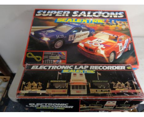 A Scalextric super saloons car racing set together with a further electronic lap recorder, both parts boxed