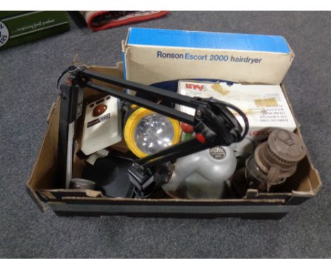 A box containing angle poise lamp, torch, vintage paraffin lamp, Polti steam iron etc
