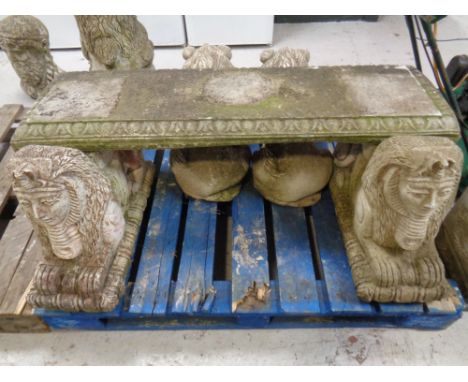 A concrete garden bench with Sphinx supports. Width 114cm 