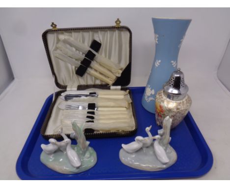 A tray containing two Nao figure groups ducks, mailing vase, silver plated Celtic rose sugar sifter together with a cased set