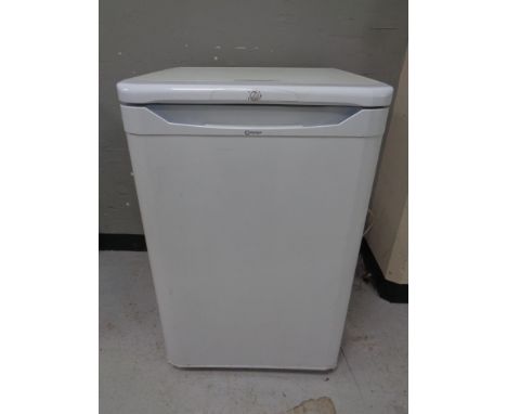 A Indesit under bench fridge