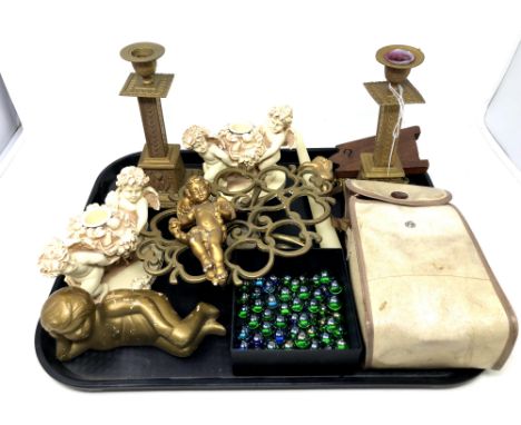 A tray of pair of brass candlesticks, cherub ornaments, marbles, Brownie camera, wooden pocket watch stand etc 