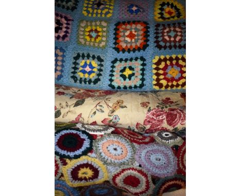 Textiles - hand knitted patchwork woollen blankets; a stitched floral bed cover