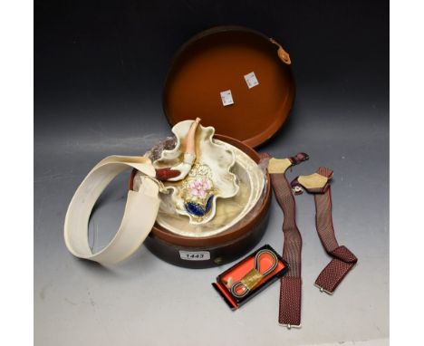 Gentlemen's accessories - an early 20th century collar box, collars, sock braces, pipe rest etc  