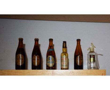 Three miniature bottles of Guiness, Harp lager, etc.