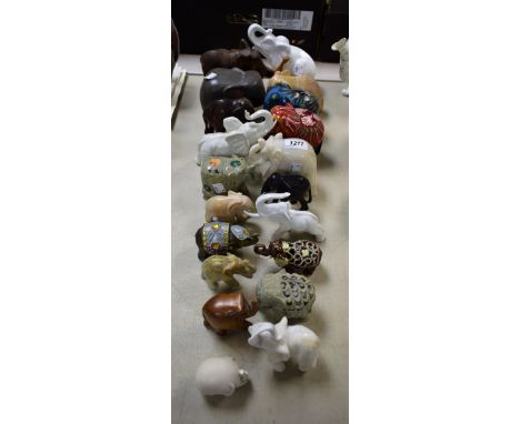 A carved soapstone model of an elephant, other elephant models, ceramic, carved hardstone, treen, painted treen, others simil