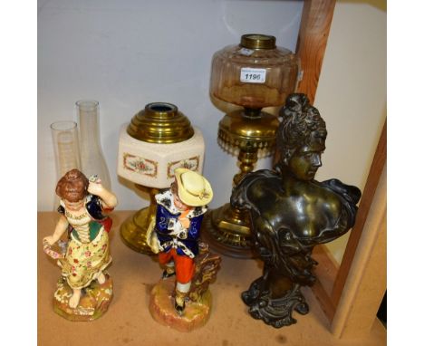 A pair of Victorian Staffordshire figures, allegorical of spring and autumn; an oil lamp; another; a bronze style bust of an 