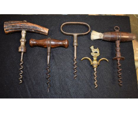 A 19th century corkscrew; four others; similar (5)