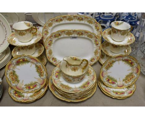 Ceramics - a late 19th century tea service, printed fruit design on cream ground to include six cups, saucers, side plates, s