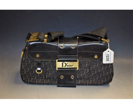 A Christian Dior leather and Dior logo fabric handbag, bronze coloured fittings