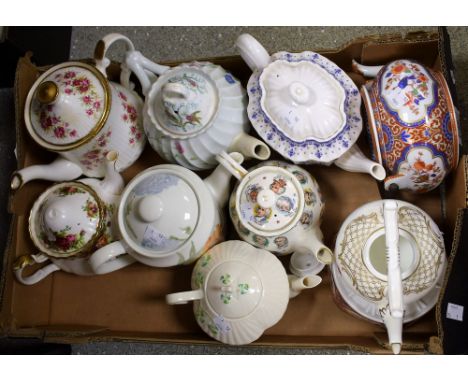 Teapots - a Belleek teapot hand painted with shamrocks with handle and finial modelled as a harp; a Spode Fleur de Lys patter