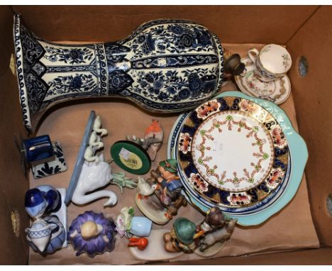 A Dutch Boch baluster vase; other souvenir plates in blue and white; a Goebel figure by Hummell; a Royal Doulton figure, Mari