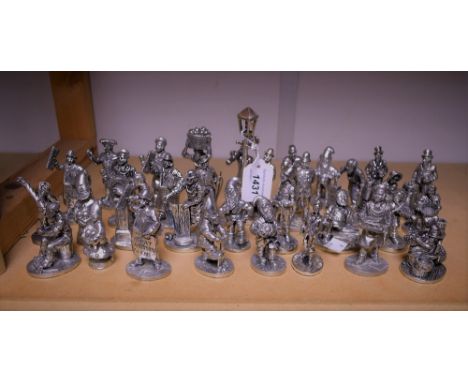 A set of  twenty four pewter figures by English Miniatures, cast as an assortment of street vendors and characters, lamp ligh