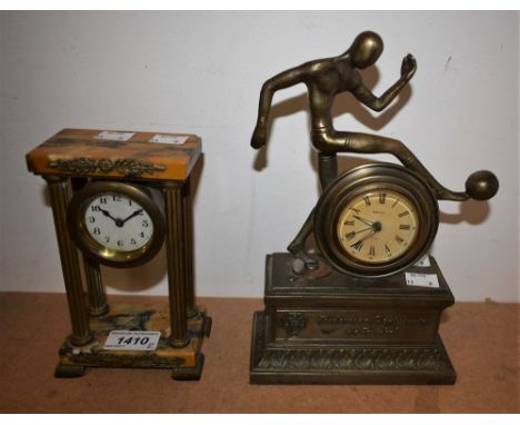 A brass portico clock; a Portuguese Football Federation clock, mounted with a figure (2)