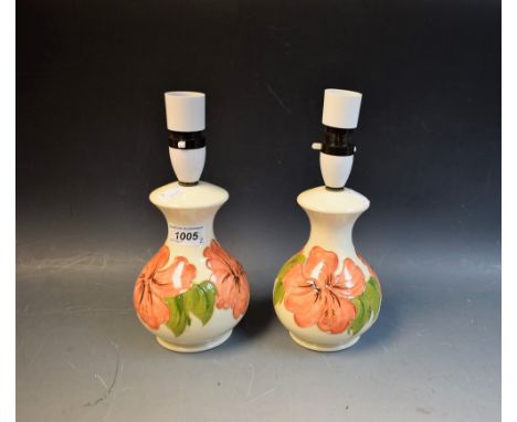 Moorcroft - a pair of Hibiscus pattern lamp bases, 16cm in height
