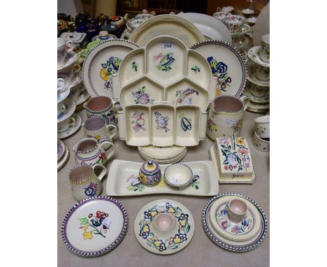 A Poole Pottery shaped circular compartmental hors d'oeuvre dish, Kua seafood pattern; others similar, three section dish, et