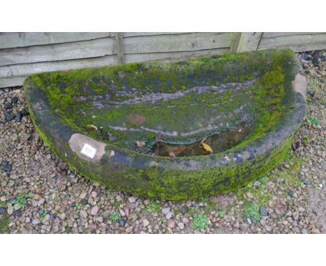 Large well-weathered stone demi-lune trough 