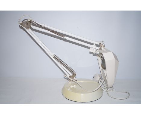 Angle poise lamp/magnifying glass 